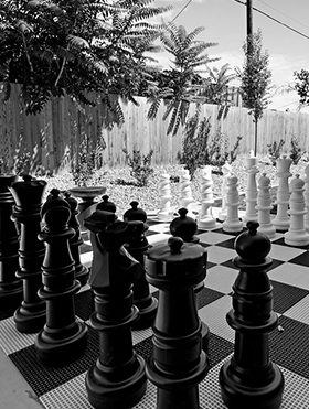 Life sized chess set outside of The Izzy.