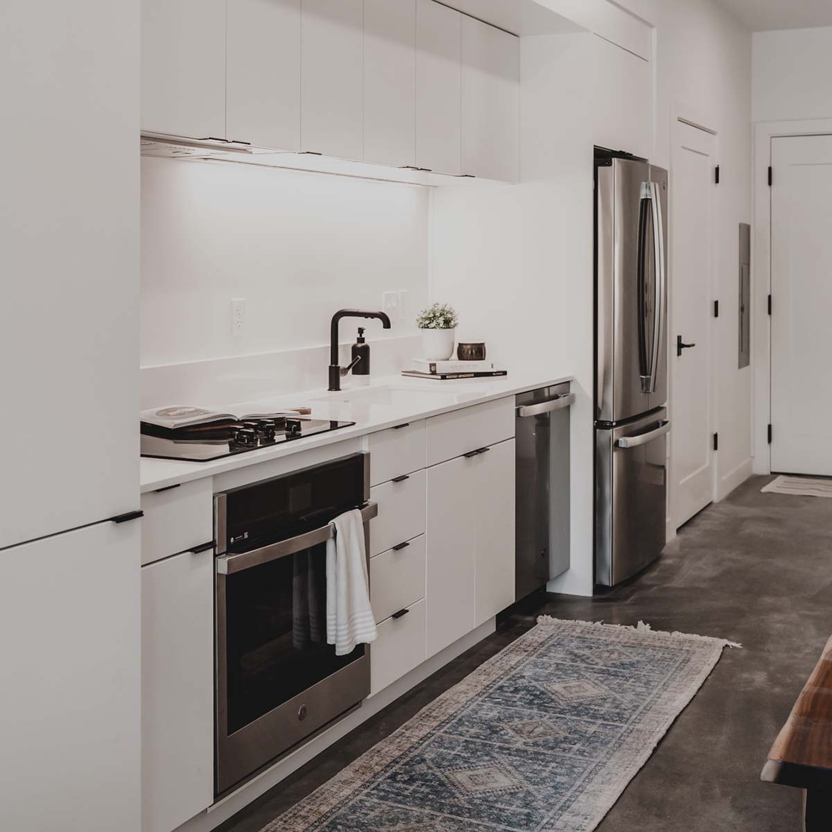 Kitchen with white cabinets and stainless steel appliances